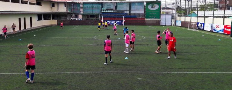 playing football in Pattaya, Thailand