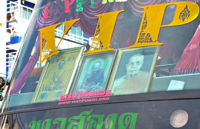 Thai Coach with pictures of monks in the widscreen