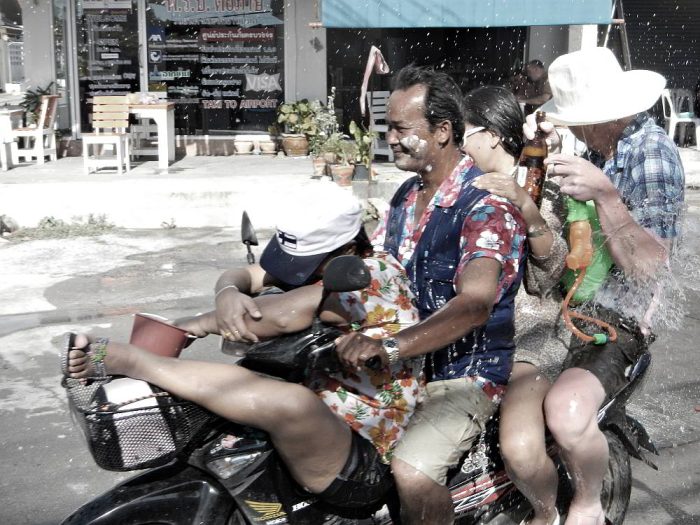 riding a motorcycle during songkran in Pattaya