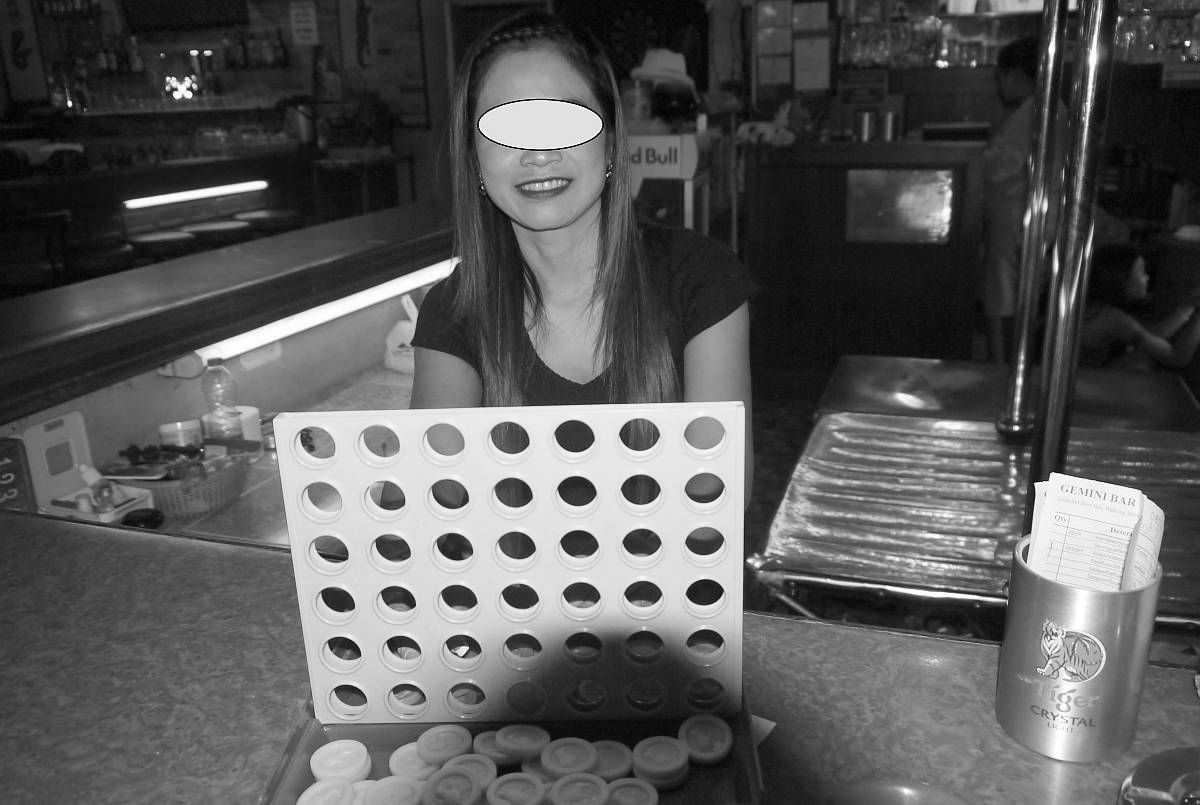 Playing bar games with a bar girl at a beer bar in Walking Street, Pattaya