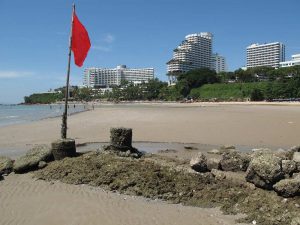 red hazard warning flag on a beach in Thailand