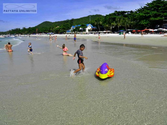 Children playing in the sea on Koh Samet Thailand