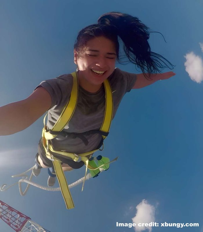 A woman mid-air at Pattaya bungy jump