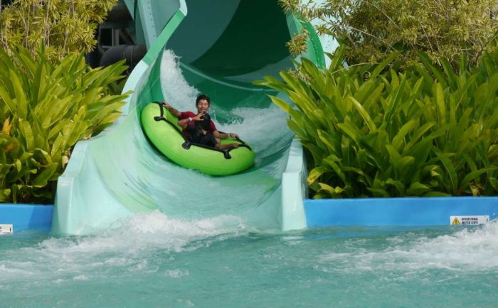 enjoying a ride on a water slide at Ramayana water park in Pattaya