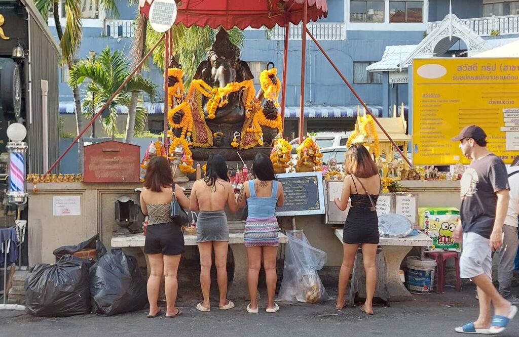 Thai women praying a the Ganesh shrine on Soi Buakhao in Pattaya