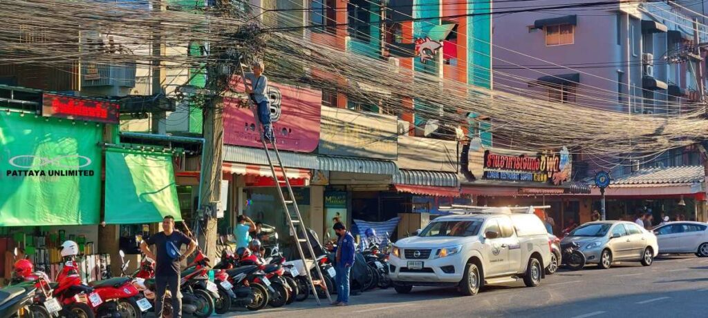 Electrician working on overhead cables on Pattaya 2nd Road