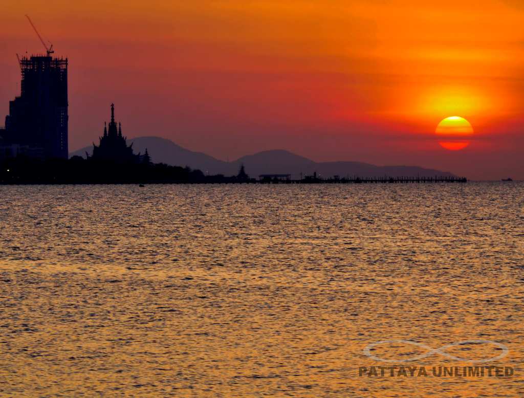 The sun setting over the Sanctuary of Truth in Pattaya, viewed from krating Lai Beach