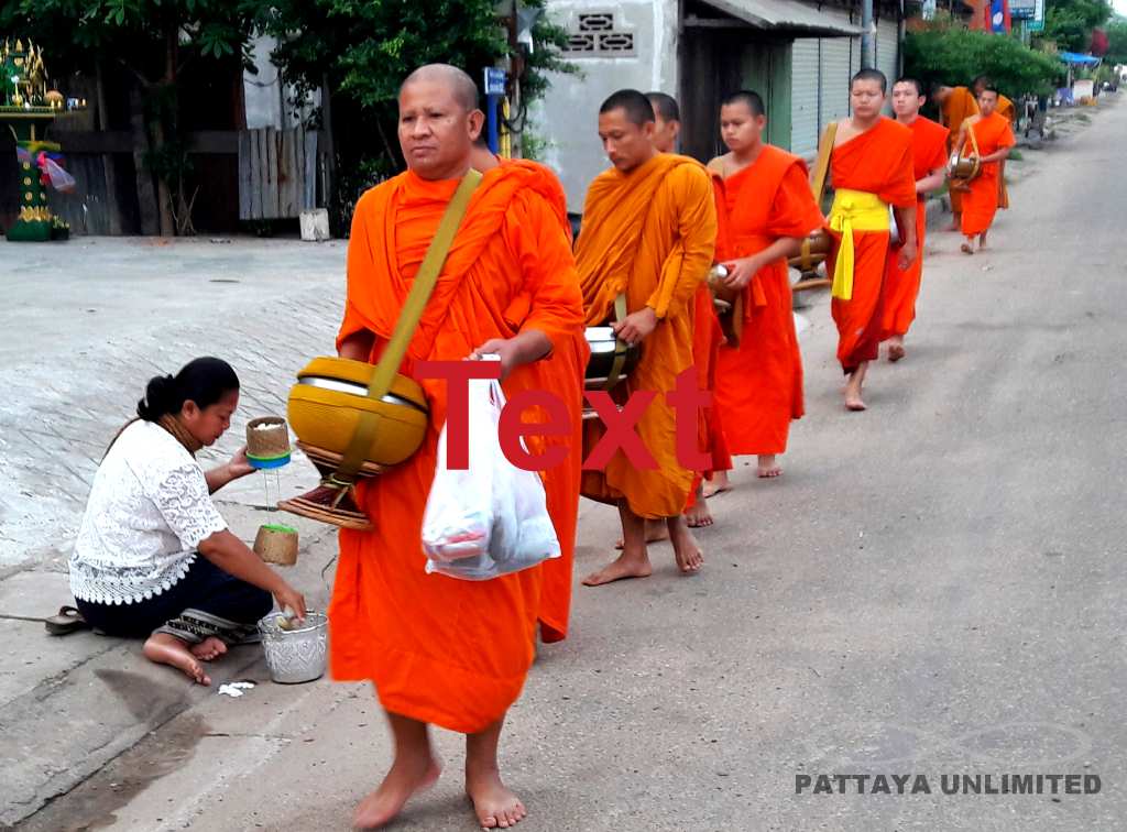 Monks collecting alms in Savannaket, Laos