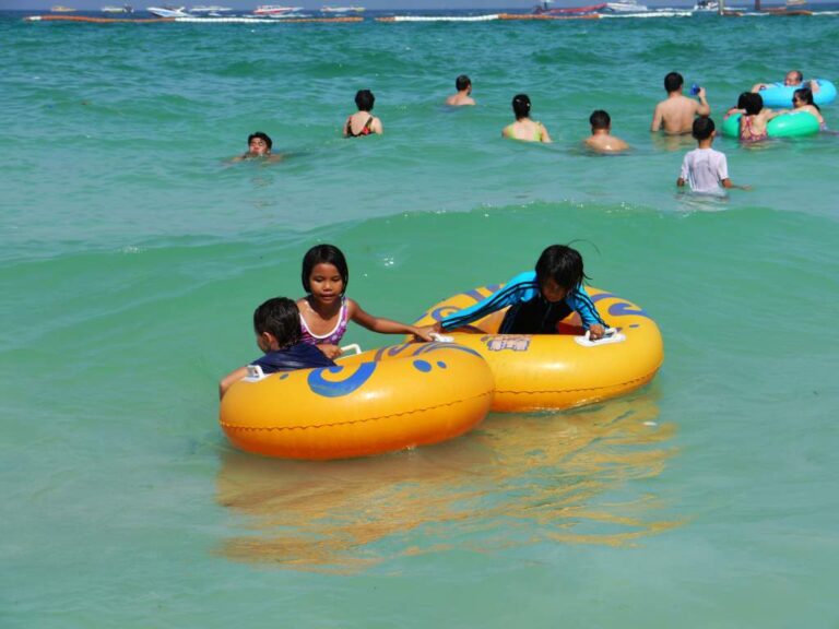 Children playing in the sea at Tawaen beach, Koh Lahn, Pattaya